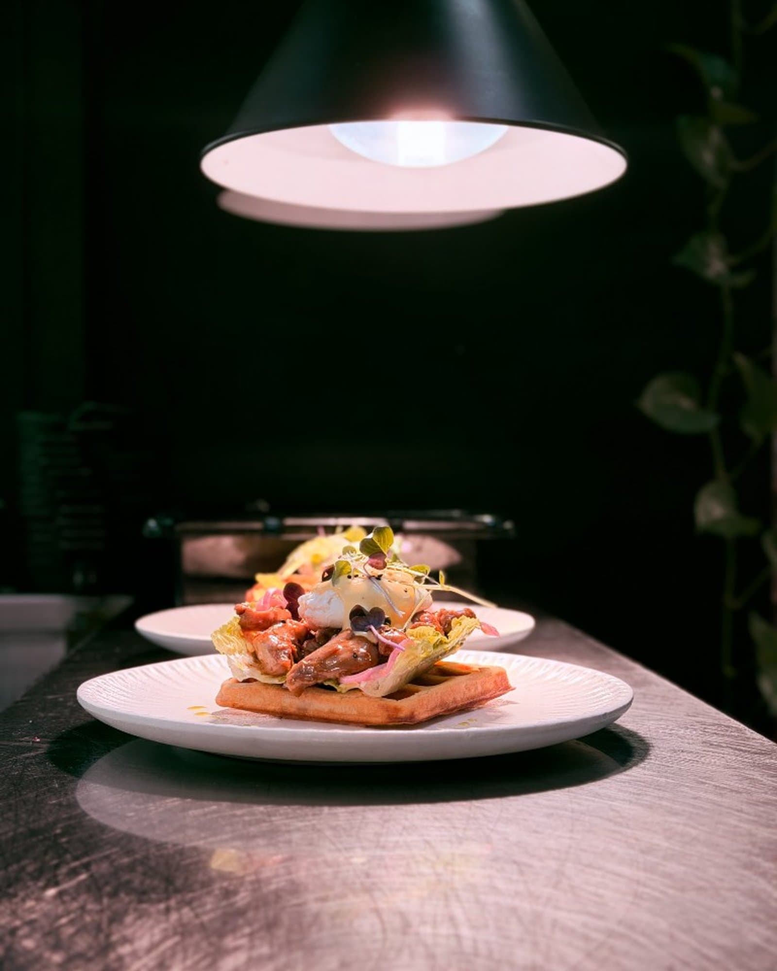 Nest Cafe Benedict waffle with fried chicken, poached egg and hollandaise